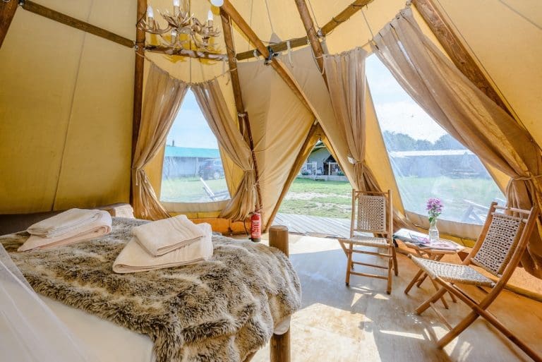An interior photo of a glamping Baby Tipi with an entrance porch. 