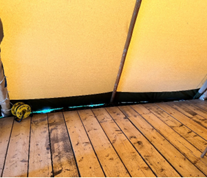 A wooden floor and a yellow tent

AI-generated content may be incorrect., Picture